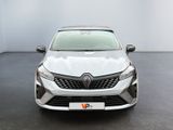 the front view of a white car parked in a room