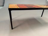 an image of a table with a colorful tile top