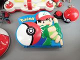 a pokemon toy and other pokemon items on a table