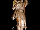 a statue of a man holding a sword and a shield