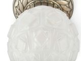 a close up of a light fixture on a white wall