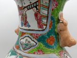 a vase that has a picture of a woman on it