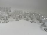 a lot of empty wine glasses sitting on a table