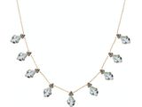 un collier en or orné de cristaux bleus et blancs montés sur une chaîne