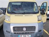 a yellow and silver van parked in a parking lot