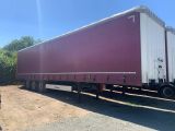 a large semi truck that is parked on the side of the road