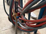 a bunch of hoses that are attached to the side of a truck