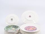 four plates with different designs on them on a white surface
