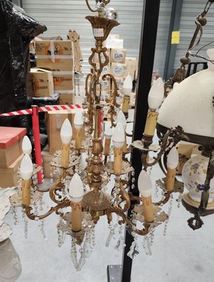 a chandelier that has a lot of lights hanging from it