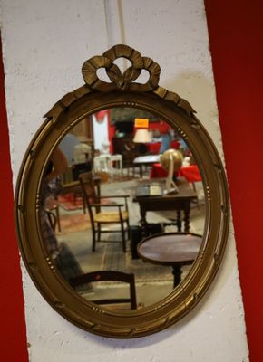 a mirror hanging on the wall of a coffee shop