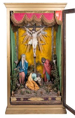 statue of the crucifix of jesus in a wooden case