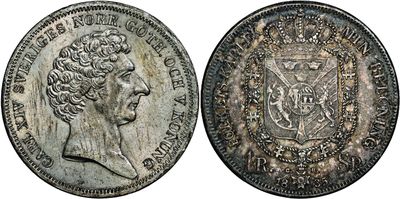 an old silver coin with a crown on the front and a crown on the back