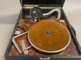 an old record player sitting inside of a suitcase