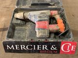 a box with a drill and a cord in it