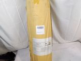 a large bag of yellow material sitting on a white surface