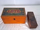a small wooden box with a lid on a bed