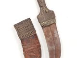 pair of old and worn knifes on a white surface