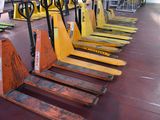 many pallets lined up in a row on the floor