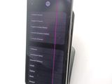 a cell phone that is sitting on top of a stand