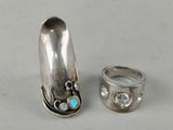 two silver rings and a silver ring with a turquoise stone