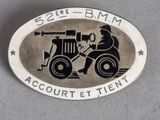 an image of a badge with a fireman on a motorbike