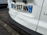a white van parked on the side of the road
