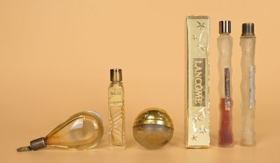 three different types of perfumes on a table