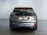 the rear end of a silver suv parked in a garage