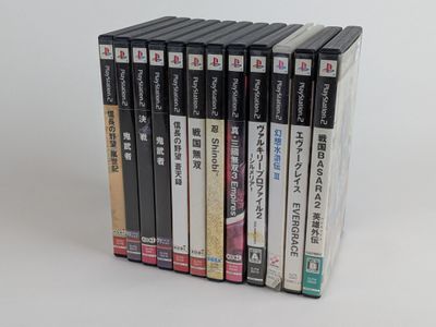 a lot of dvds that are stacked on top of each other