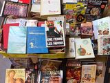 a lot of books that are sitting on the floor