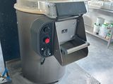 a machine that is sitting on a table in a kitchen