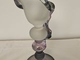 a glass vase that is sitting on a table