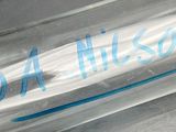 a clear plastic bottle with a blue writing on it
