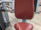a red chair that is sitting in a gym