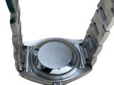 a close up of a watch on a white background