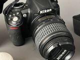a camera with a lens attached to it next to a camera case