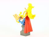 toy figurine of a woman with a microphone and a man in a red cape