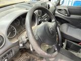 dashboard of a car with a steering wheel and dashboard gauges