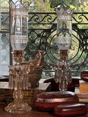 a table with a lot of antique items on it