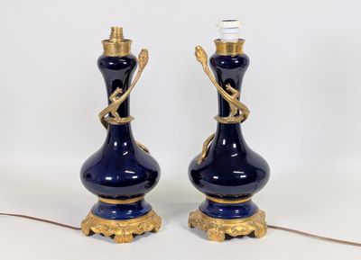 pair of blue and gold vases with gold accents on a white background