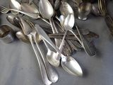 a lot of spoons and spoon spoons on the table