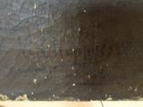 a close up of a piece of wood with some paint on it