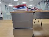 a desk with a bunch of books on top of it