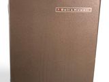 an image of a brown suitcase sitting on top of a white surface