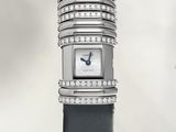 a watch with a lot of diamonds on it ' s face