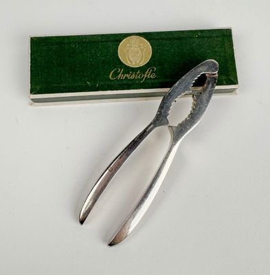 a pair of pliers sitting next to a box of matches