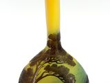 a vase with a painting on it sitting on a white surface