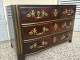 a dresser that has a lot of drawers on it