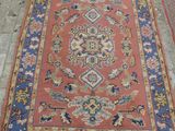 rugs and rugs on the floor in a room with tile flooring