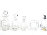 a lot of glass bottles that are lined up on a table